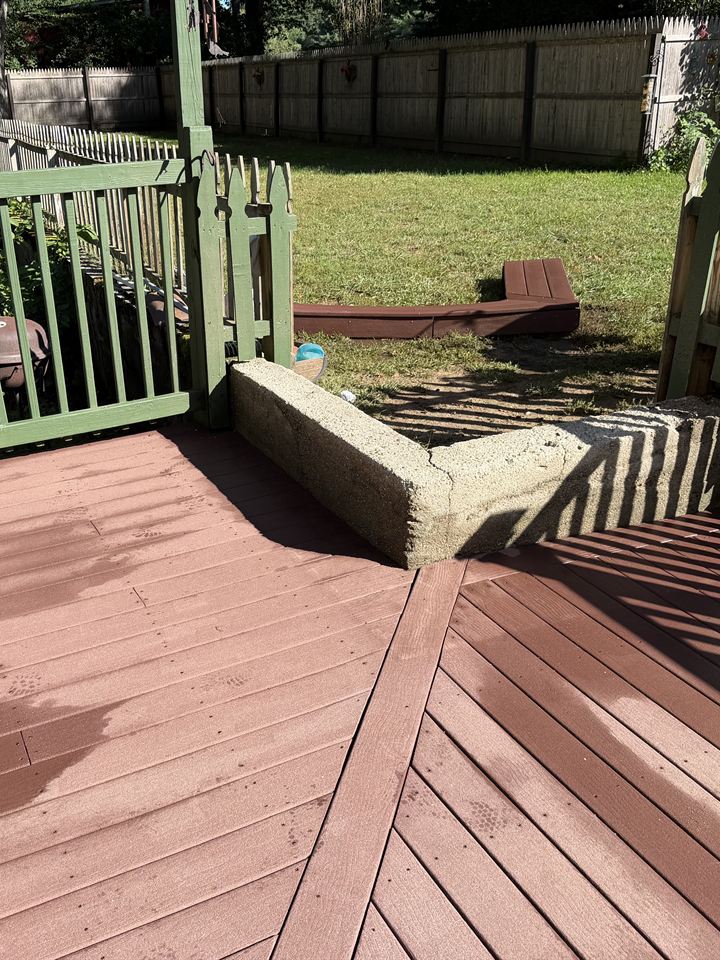 Deck and concrete curb after washing
